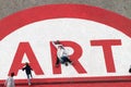 People at Centre Pompidou over art sign