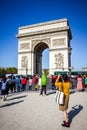 Paris - September 10, 2019 : Tourist taking pictures in front of Arc de Triomphe on place de lÃ¢â¬â¢Etoile