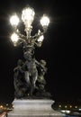 Paris: Statue on Alexandre III bridge at night Royalty Free Stock Photo