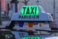 Paris taxi detail and Arc de Triomphe in the background