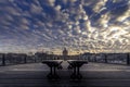 Paris wooden bench on Pont des Arts wooden bridge at sunset