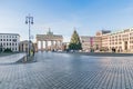 Pariser Platz with the Brandenburg Gate, Hanukkah candlestick and Christmas tree in Berlin, Germany