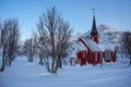 The parish church in Flakstad in winter covered with snow, near Ramberg Lofoten, Norway