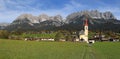 The parish church at the Going village with the famous mountain Wilder Kaiser Royalty Free Stock Photo