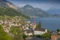 Parish Church St. Maria and the village of Weggis along the shore of Lake Lucerne, Switzerland