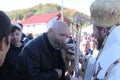 Parishioner kissing the cross