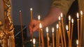 The parishioner put a candle inside an Orthodox church Royalty Free Stock Photo