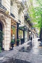 Parisian architecture and historical buildings, restaurants and boutique stores on streets of Paris, France