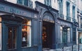 Parisian architecture and historical buildings, restaurants and boutique stores on streets of Paris, France