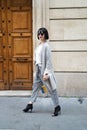 Parisian fashion model walk outdoor in street. Royalty Free Stock Photo