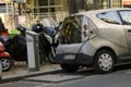 Parisian owner recharges batteries of your electric car at charging station