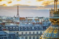 Parisian skyline with roofs and dramatic colorful sunset