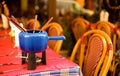 Parisian street cafe with a fondue pot