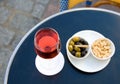 Parisian street cafe table with aperitif