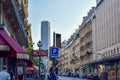 Parisian Street with Metro Sign and Montparnasse Tower in Summer