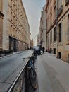 Parisian street, view of a small road and the haussmannian building in Paris center, France