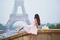 Parisian woman in front of the Eiffel tower Royalty Free Stock Photo