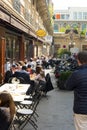 Parisians eating outside early spring Royalty Free Stock Photo