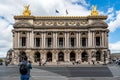 Parisians relaxing on the steps of the Opera Garnier house - Paris, France