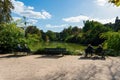 Parisians sunbathing on the shore of the lake of Parc Montsouris - Paris, France