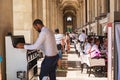 Parisians and tourists enjoy summer day drinks in cafe on a terrace of Louvre Royalty Free Stock Photo