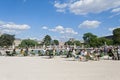 Parisians and tourists in Tuileries garden (Jardin des Tuileries) Royalty Free Stock Photo