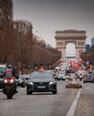 Parisien Taxi on Champs Elysee boulevard in the evening