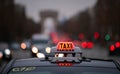 Parisien Taxi on Champs Elysee boulevard in the evening Royalty Free Stock Photo