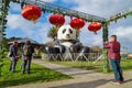 Moon festival decorations in a park: giant inflatable panda and Chinese lanterns