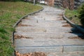 Park: avenue with stone steps in the shape of a double curve.