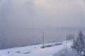 park on the bank of the Yenisei River on an early frosty foggy winter morning Royalty Free Stock Photo