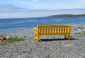 Park bench at the beach overlooking the coastline