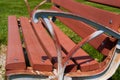 Park Bench close up from Side Rusty Arm rest