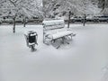 Park bench covered with snow Royalty Free Stock Photo