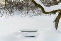 Park Bench Covered In Winter Snow Royalty Free Stock Photo