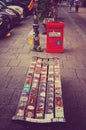 Park bench in the Hamburg Schanzenviertel opposite the red flora with many lifters and red trash can, one day after the end of the Royalty Free Stock Photo