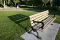 Park bench with light and shadow in the public park Royalty Free Stock Photo