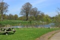 Park bench overlooking the lake at Hever Royalty Free Stock Photo