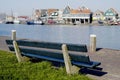 Park bench overlooking Volendam Harbour, Holland Royalty Free Stock Photo
