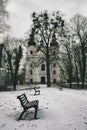 Park, bench, pathway, bare tree and church