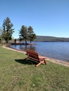 Park bench on public beach Royalty Free Stock Photo