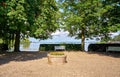 Park bench in the public park with Lake Schwerin in the background