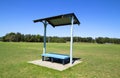 Park bench with roof. Royalty Free Stock Photo