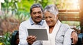 Park, bench and senior couple with tablet for social media, smile and connection with internet. Relax, mature and woman Royalty Free Stock Photo