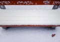 Park bench in snow winter background Royalty Free Stock Photo