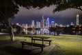 Park bench with Surfers Paradise city skyline on dusk background, Gold Coast, Australia Royalty Free Stock Photo