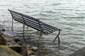 Park bench swamped by a rising sea level