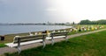 Park bench on top of a dike at the beach of Cuxhaven, Germany Royalty Free Stock Photo