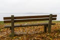 Park bench and tree on lake Chiemsee, Germany Royalty Free Stock Photo