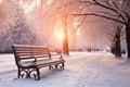 Park bench and trees covered by heavy snow. Lots of snow. Sunset Royalty Free Stock Photo